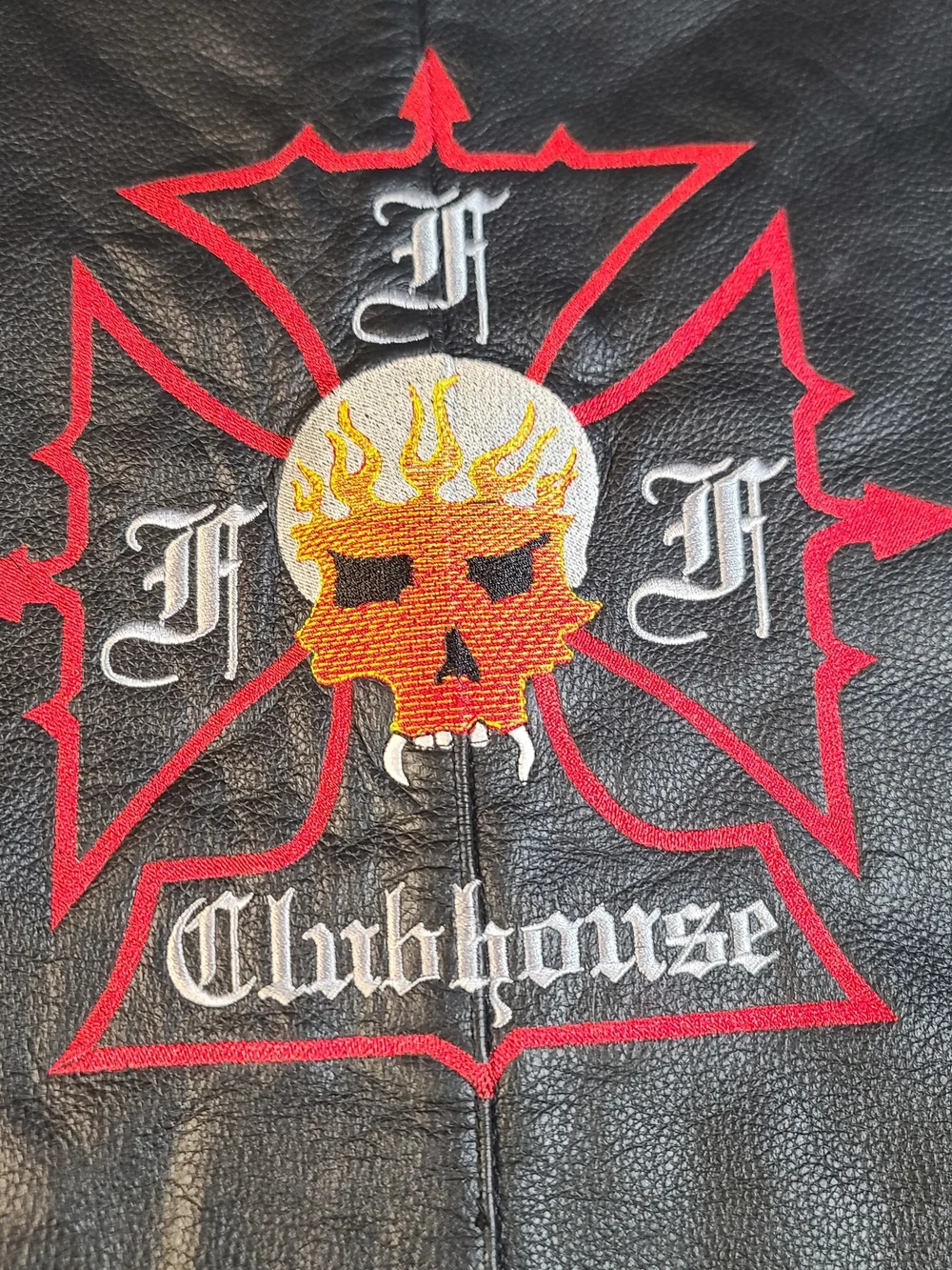 Black Leather Clubhouse Vest with Red & Orange Skull Emblem